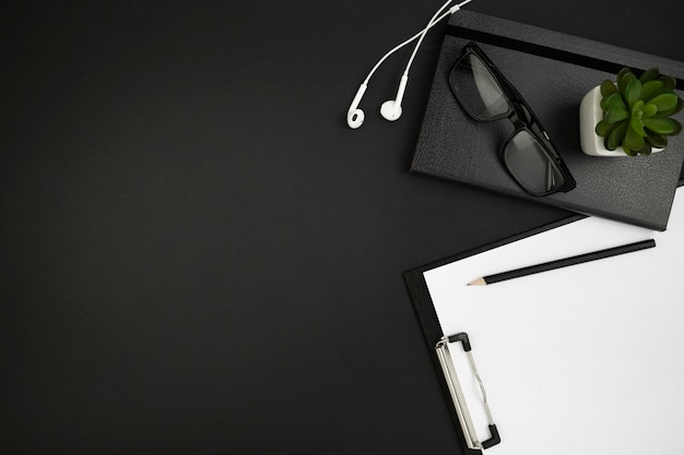 Flat lay of desk dark concept with copy space