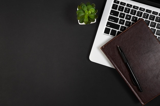 Flat lay of desk dark concept with copy space