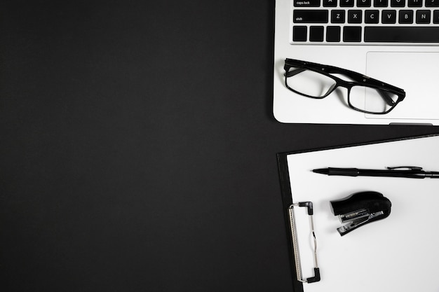 Flat lay of desk dark concept with copy space