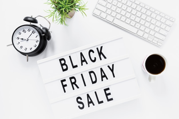 Free photo flat lay desk with black friday light box