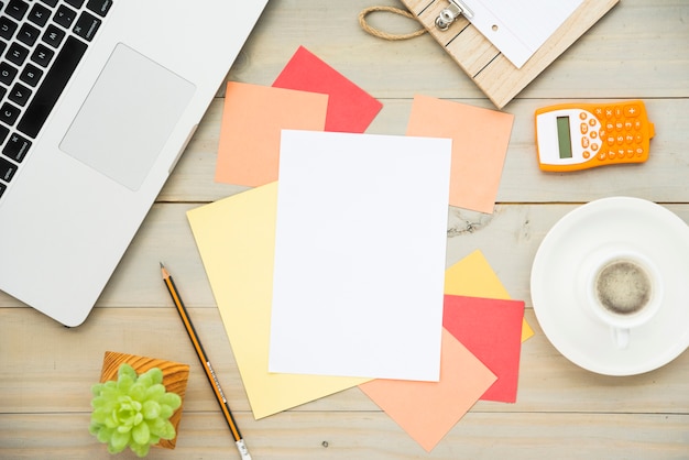 Flat lay of desk with blank note