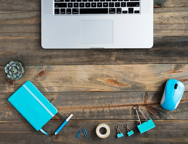 Flat lay of desk with laptop and copy space