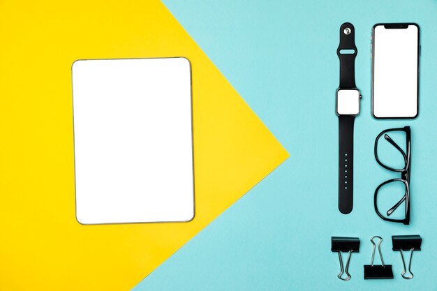 Flat lay devices on colourful background