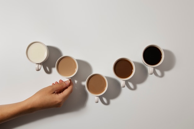 Flat lay different coffee cups arrangement