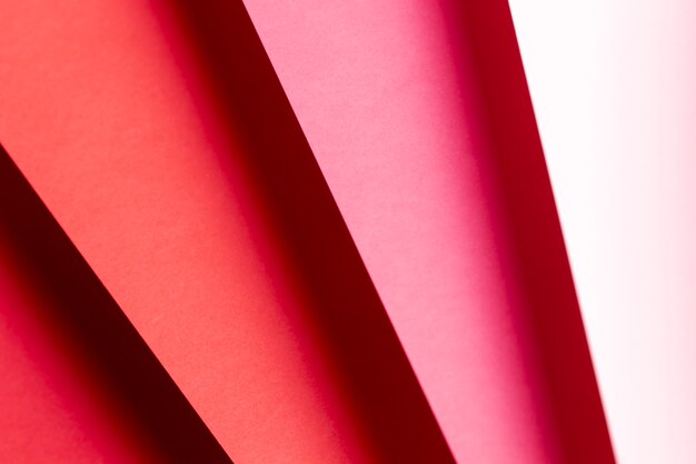 Free photo flat lay different shades of red papers close-up