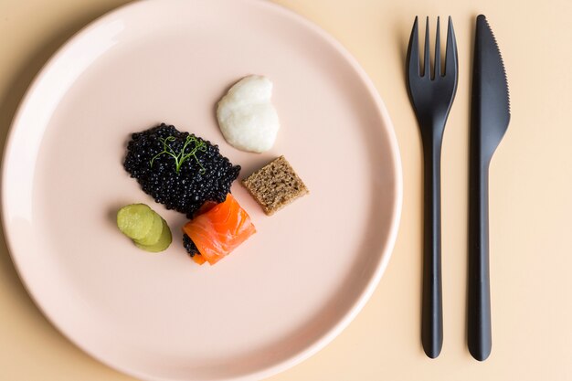 Flat lay dish with caviar