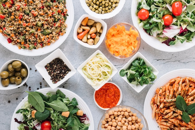 Flat lay of dishes with hot peppers and pasta