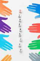 Free photo flat lay diversity assortment with different colored paper hands