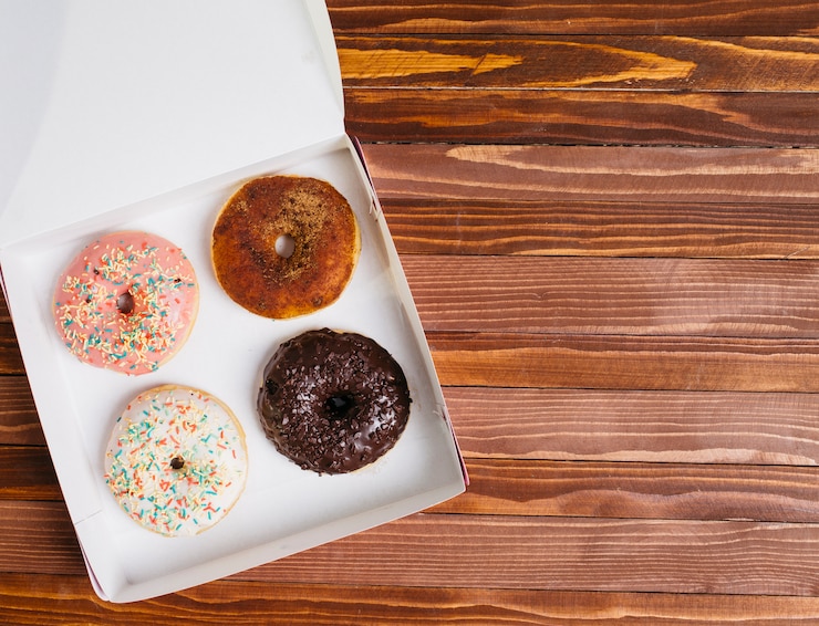 Free Photo flat lay donut composition with copyspace