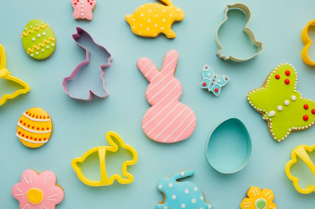 Flat lay of easter eggs with bunny and butterfly shapes