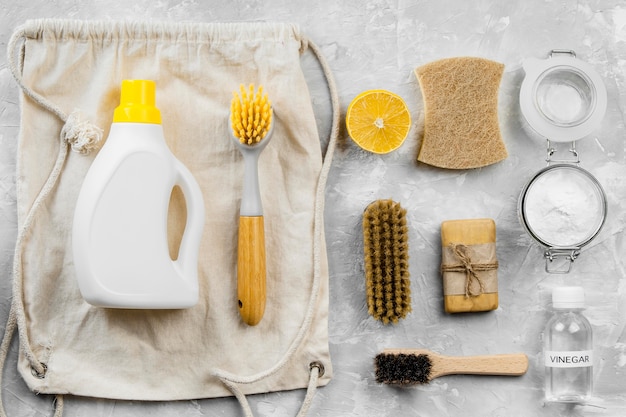 Flat lay of eco-friendly cleaning products with brushes and baking soda