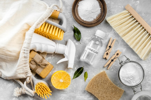 Flat lay of eco-friendly cleaning products with brushes