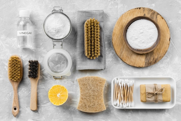 Flat lay of eco-friendly cleaning products with lemon and baking soda