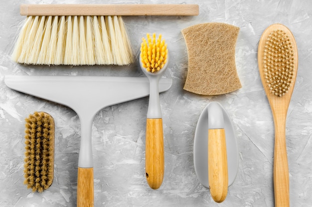 Flat lay of eco-friendly cleaning products with selection of brushes