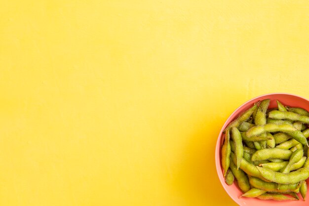 Flat lay edamame beans in bowl with copy space