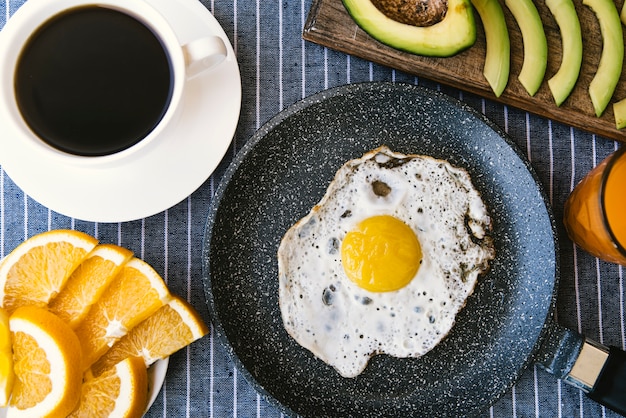 Flat lay egg and fruit breakfast 