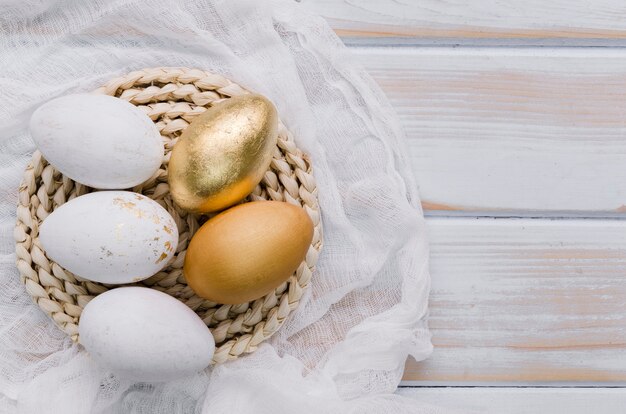 Flat lay of eggs for easter on placemat