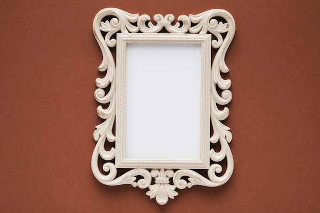 Flat lay elegant frame with brown background