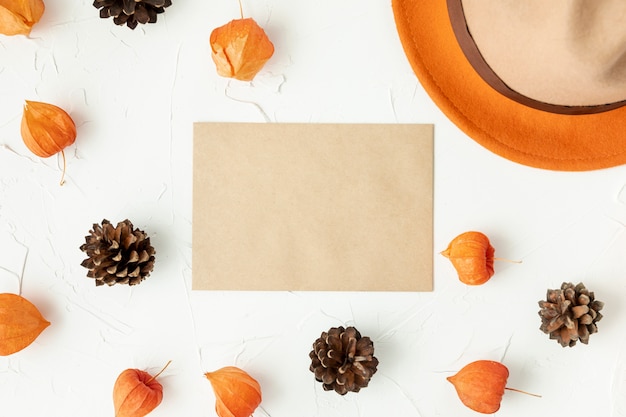 Flat lay empty envelope with pine cones