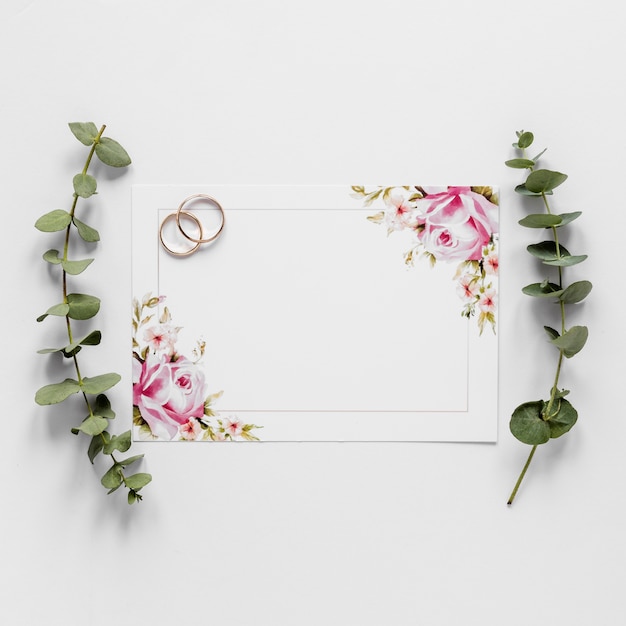 Flat lay engagement rings and branches