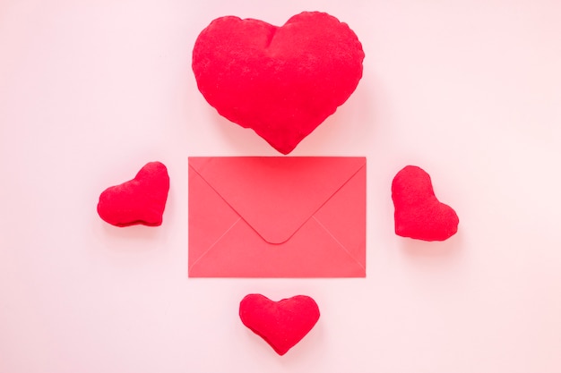 Flat lay of envelope with hearts for valentines