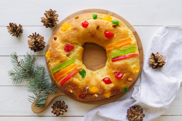 Flat lay of epiphany day dessert with pine cones