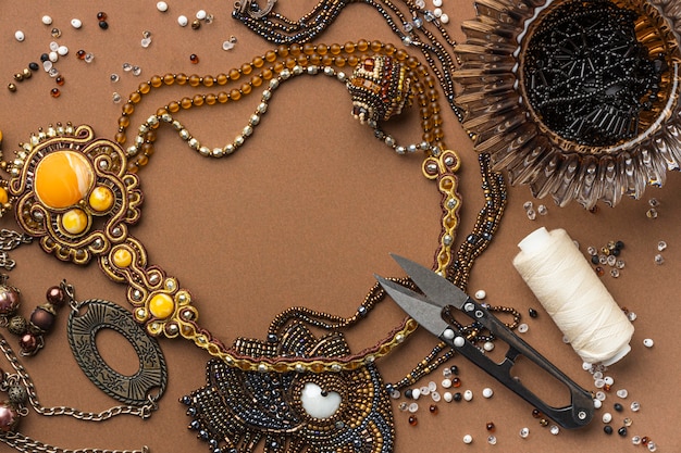 Flat lay of essentials for bead working with scissors