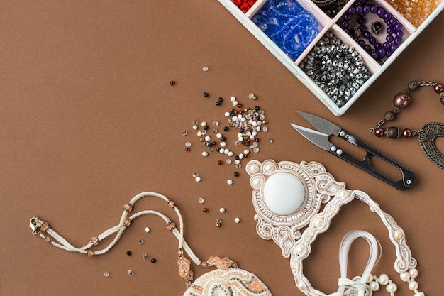 Free photo flat lay of essentials for bead working