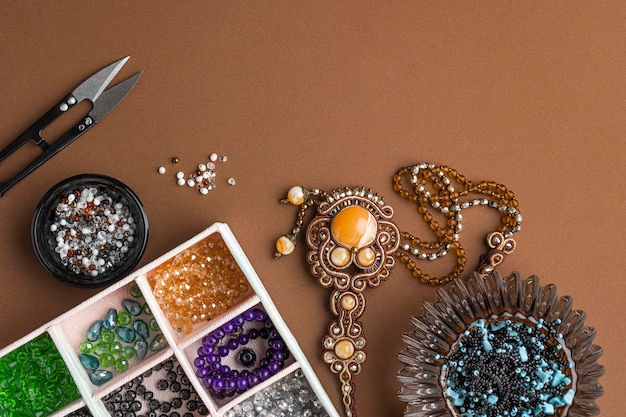 Free Photo | Flat lay of essentials for bead working