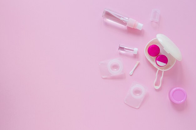 Flat lay eye care accessories with copy space