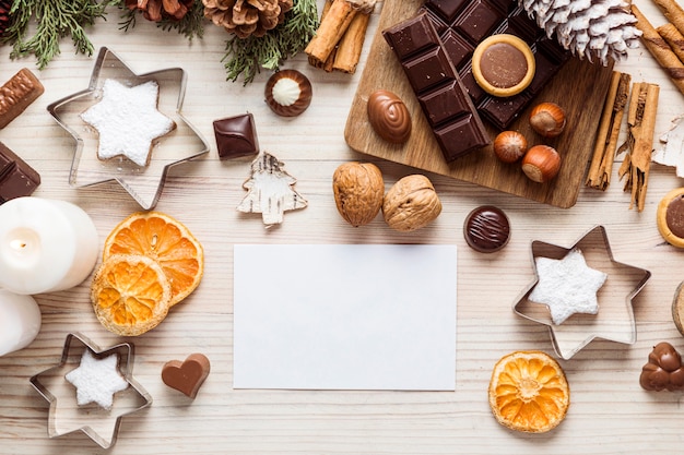 Flat lay festive christmas meal assortment with empty card