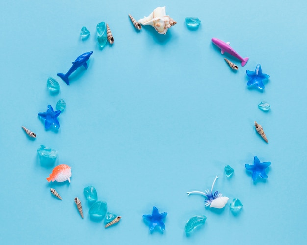 Free photo flat lay of fish figurines in circle