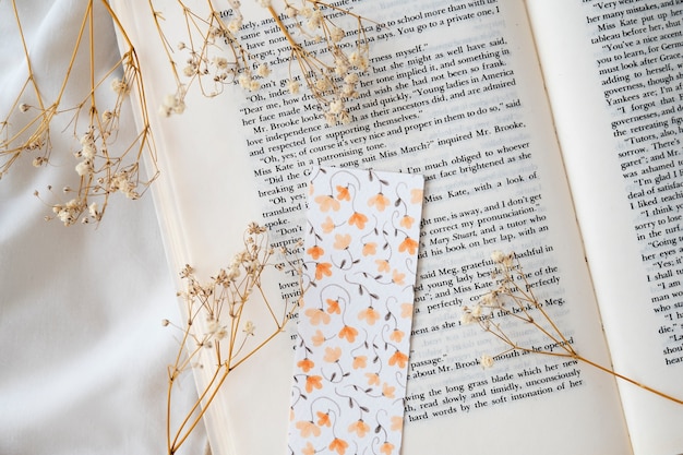 Flat lay floral bookmark on book