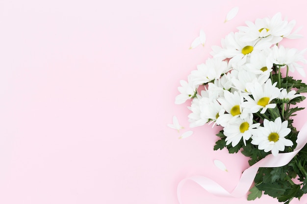 Flat lay floral frame with pink background