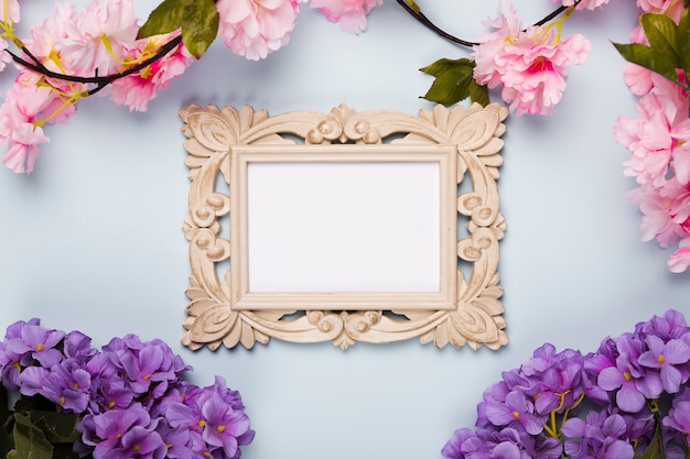 Flat lay flowers frame on table