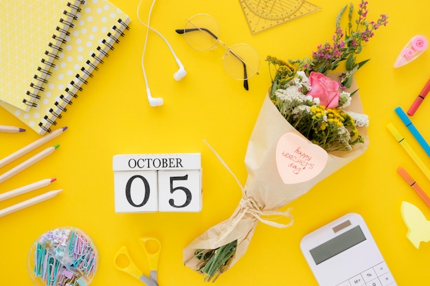 Flat lay flowers on yellow background