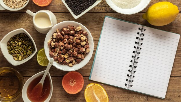 Flat lay of food ingredients with notebook