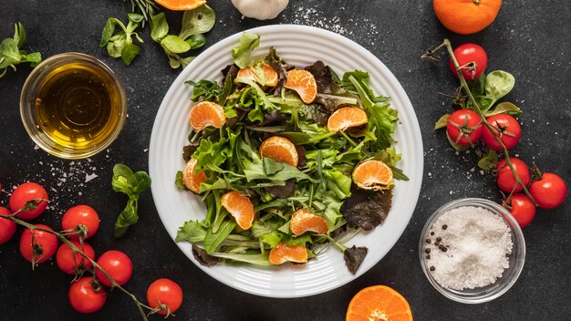 Flat lay of food ingredients with salad on plate