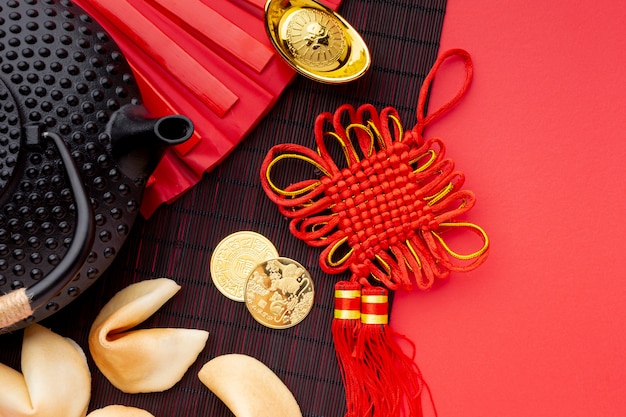 Flat lay of fortune cookies and teapot chinese new year