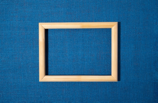 Flat lay frame on blue background