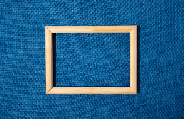 Flat lay frame on blue background