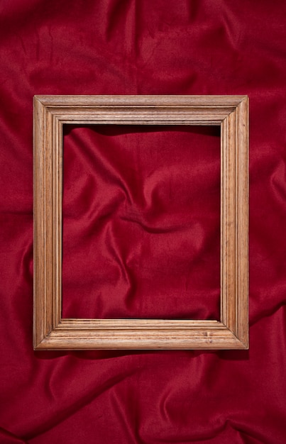 Free photo flat lay frame on red background