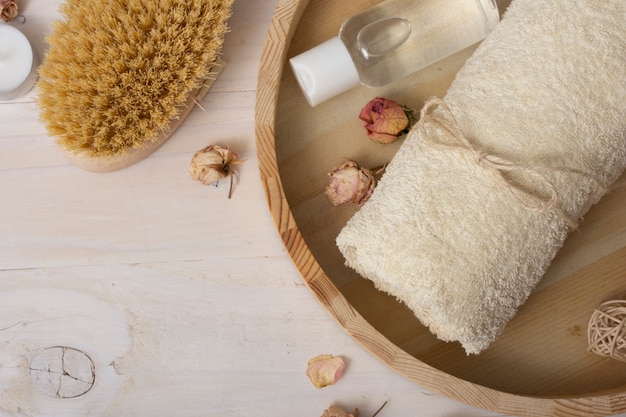 Flat lay frame with bath items on wooden background