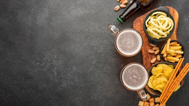 Flat lay frame with beer and snacks