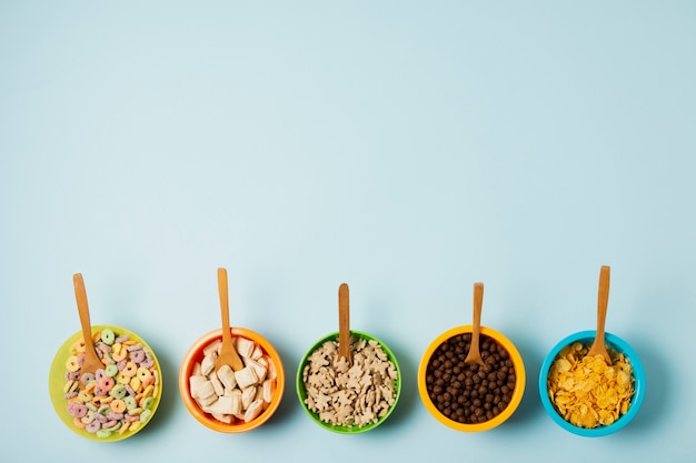 Flat lay frame with cereal bowl and spoons