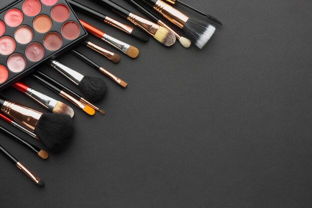 Flat lay frame with different make-up brushes 