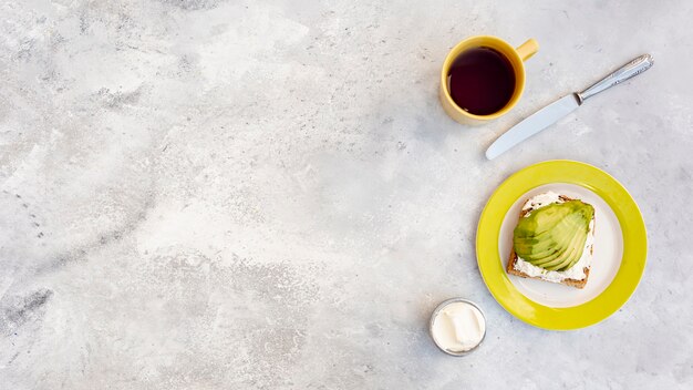 Flat lay frame with food arrangement on stucco background