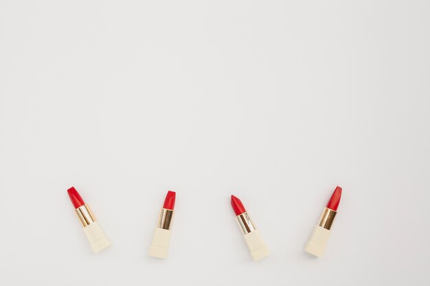 Flat lay frame with red lipstick and copy-space