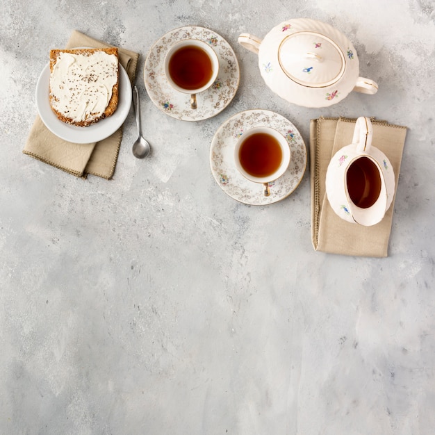 Flat lay frame with tea cups and copy-space