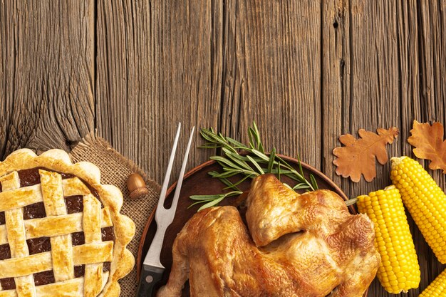 Flat lay frame with turkey and pie 